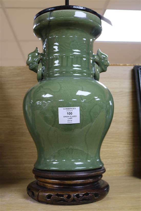 A Chinese celadon green glazed lamp